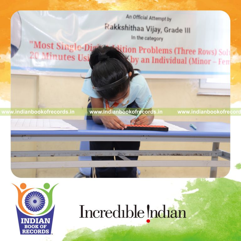 Young girl solving single-digit addition problems using an abacus within a timed session recognized by Indian Book of Records