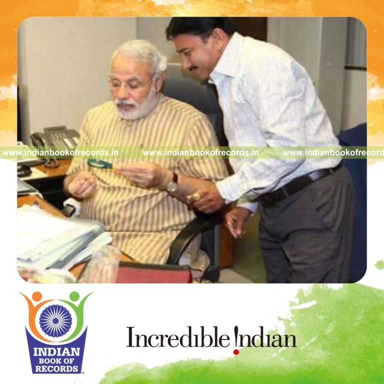 Tiny national logo of Azadi Ka Amrit Mahotsav inscribed on a rice grain recognized by Indian Book of Records