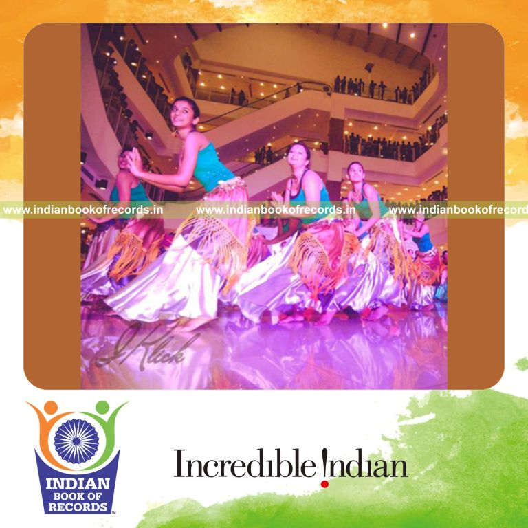 participants performing belly dance at multiple venues for Indian Book of Records