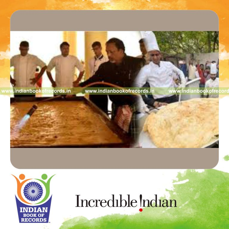 team preparing large malpua dessert for Indian Book of Records