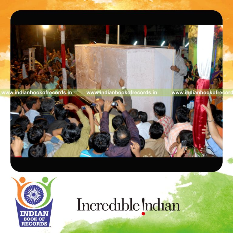 male individual creating large natural ice cream for record achievement in Indian Book of Records