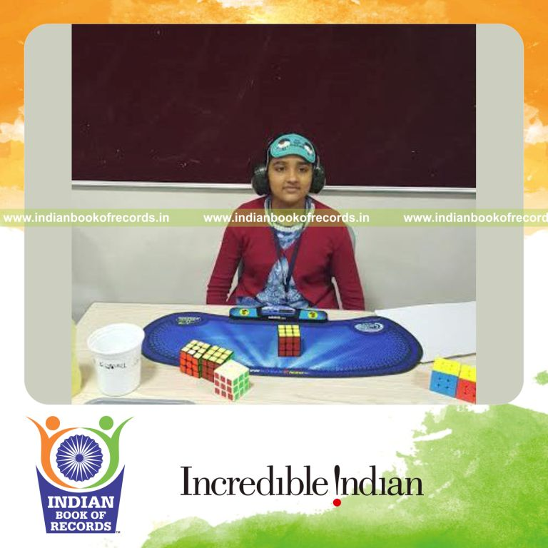 female solving rubiks cube while blindfolded quickly for Indian Book of Records