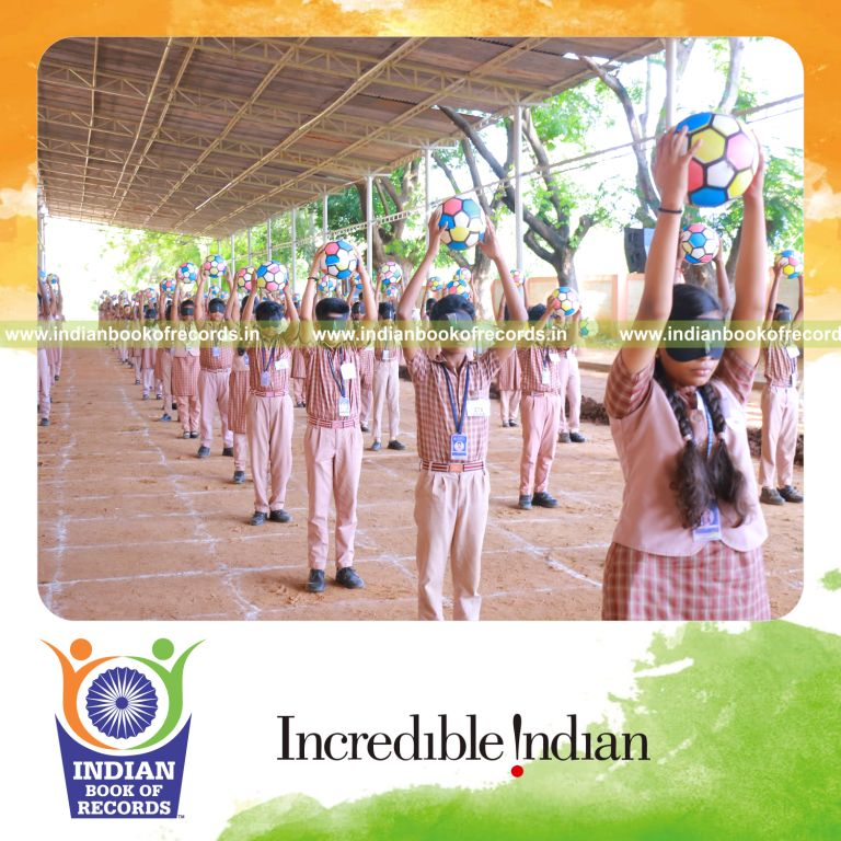 Participants performing coordinated sports drills while blindfolded and holding balls simultaneously for Indian Book of Records