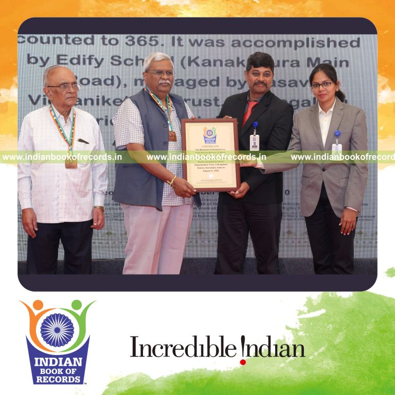 Large group participating in a continuous book review relay over 12 hours recognized by Indian Book of Records
