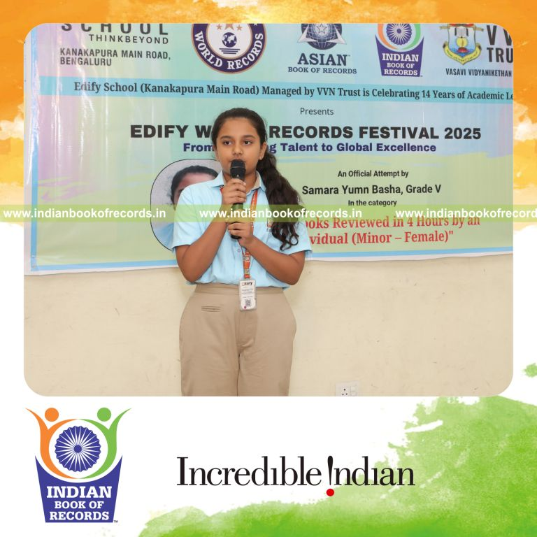 Young girl reviewing numerous books within a four-hour session recognized by Indian Book of Records