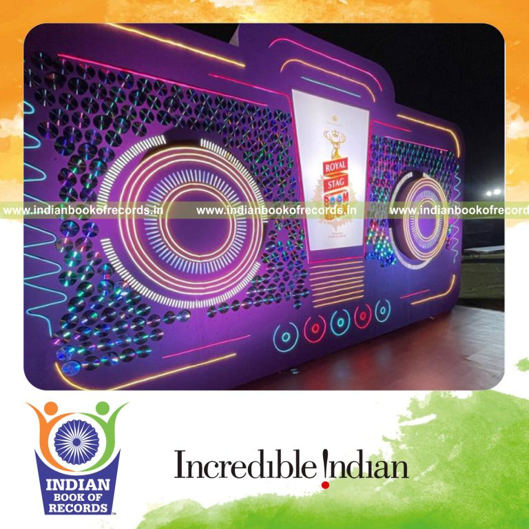 Oversized boombox structure decorated with fan autographed CDs recognized by Indian Book of Records