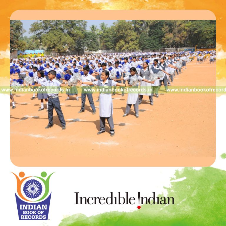 participants performing sports drill with pom poms for Indian Book of Records