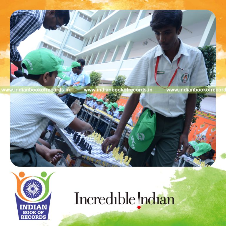 young boy playing chess with multiple opponents simultaneously for Indian Book of Records