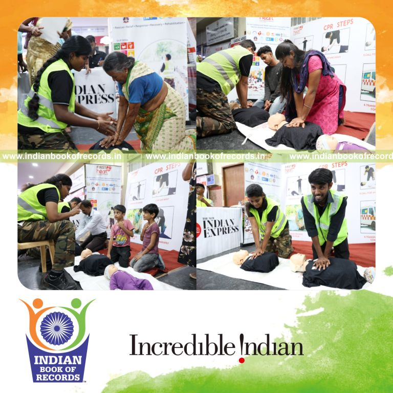 Team performing continuous CPR chest compressions on mannequins during a marathon session recognized by Indian Book of Records