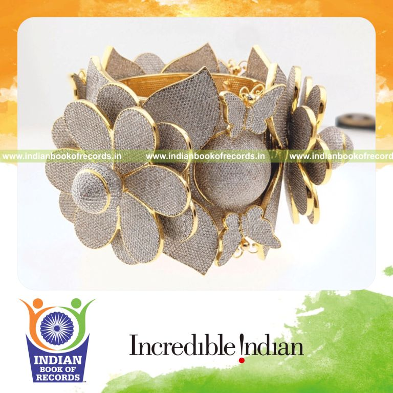 A bangle adorned with a large number of diamonds showcasing intricate jewelry craftsmanship for the Indian Book of Records