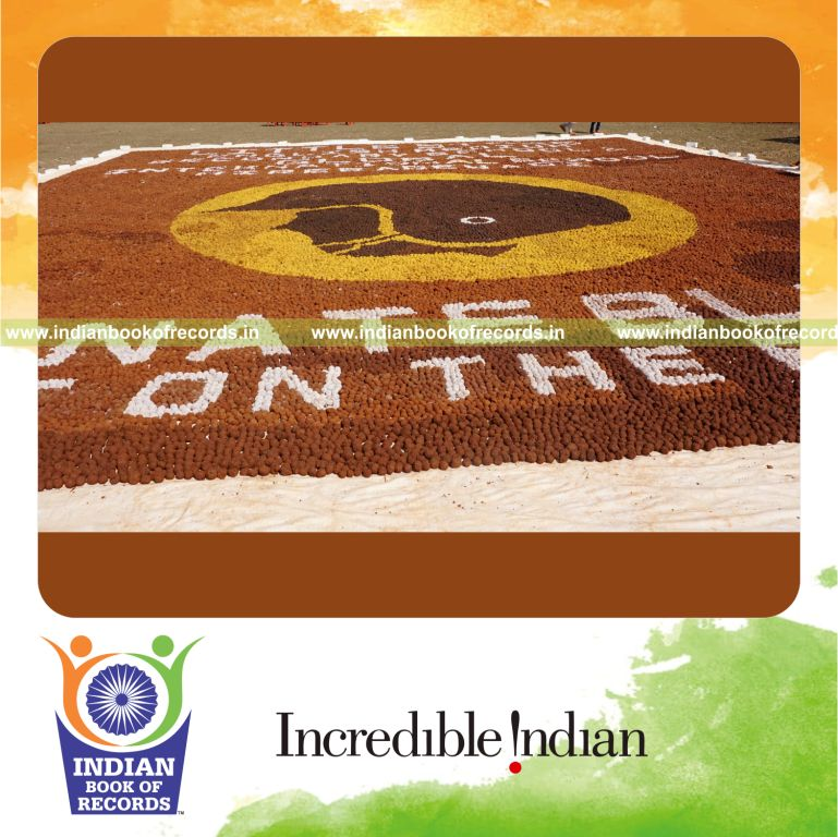 A large eco-friendly mosaic artwork made from seed balls by a team for the Indian Book of Records