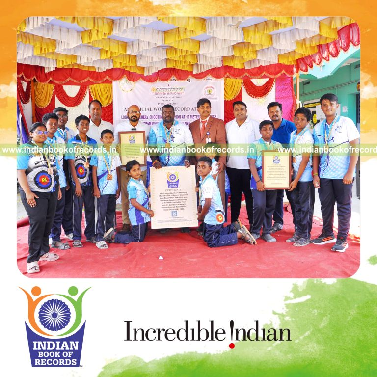 Archers competing in an endurance shooting challenge on nail boards, recognized by Indian Book of Records.