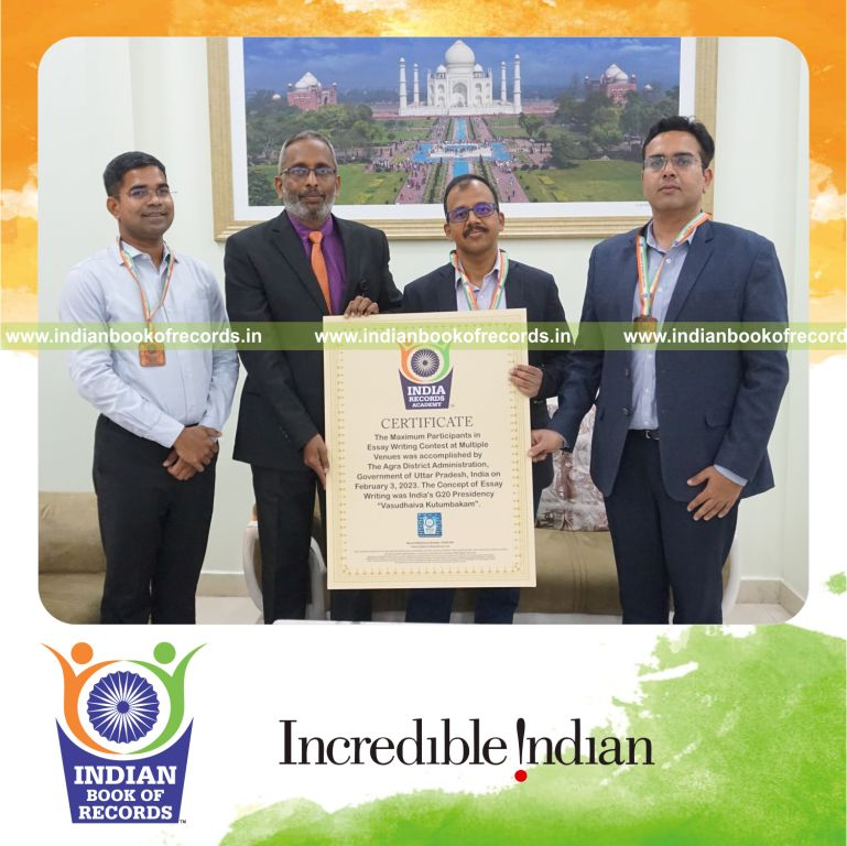 Participants taking part in an essay writing contest across multiple locations for the Indian Book of Records