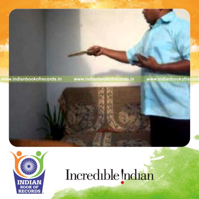 individual performing kryptonite cuts while bouncing ball on wall for record in Indian Book of Records