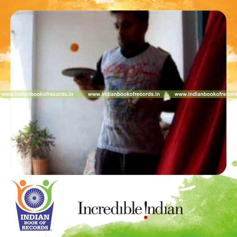 individual performing fastest reverse scissor cuts while bouncing ball for record in Indian Book of Records