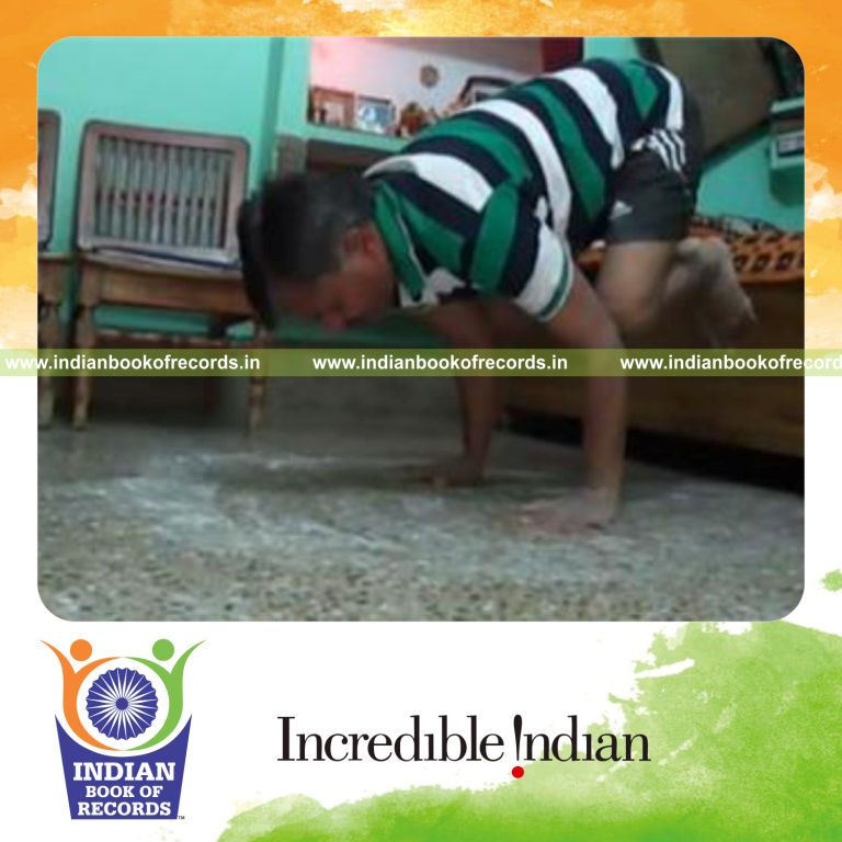 individual performing 180 degree turn while holding crow pose for record in Indian Book of Records