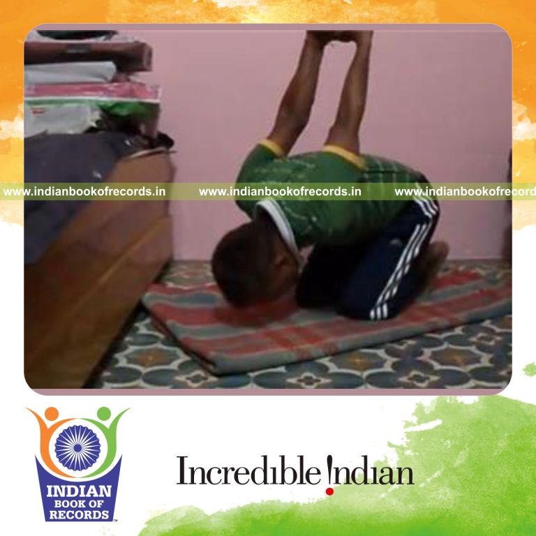 individual performing 200 head dips while kneeling for record in Indian Book of Records