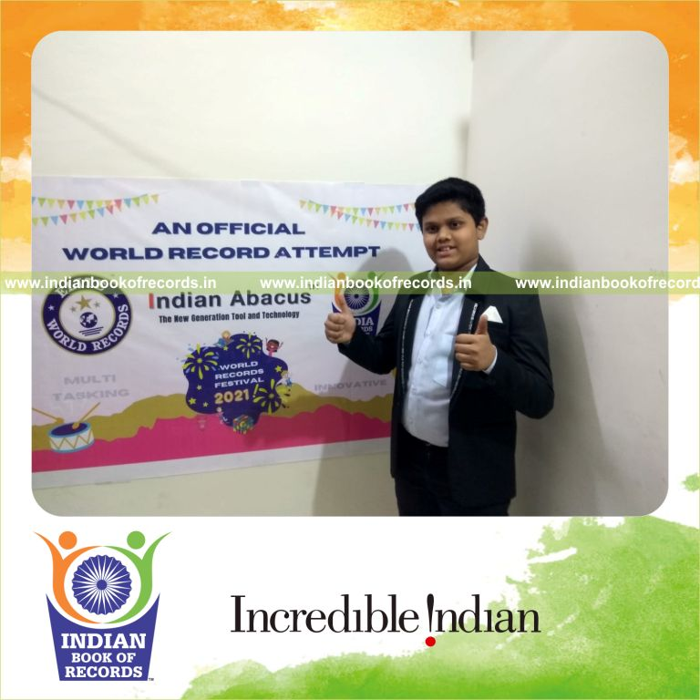 individual male reciting abacus formulae while solving rubik cube simultaneously for Indian Book of Records