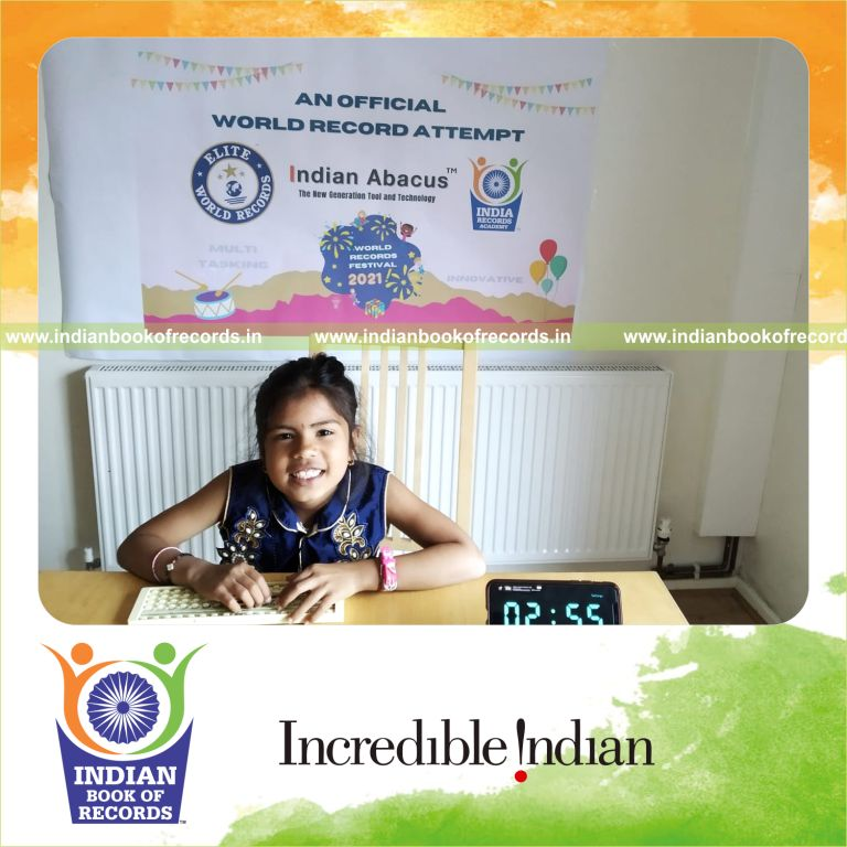 individual female solving arithmetic problems while listening to music for Indian Book of Records