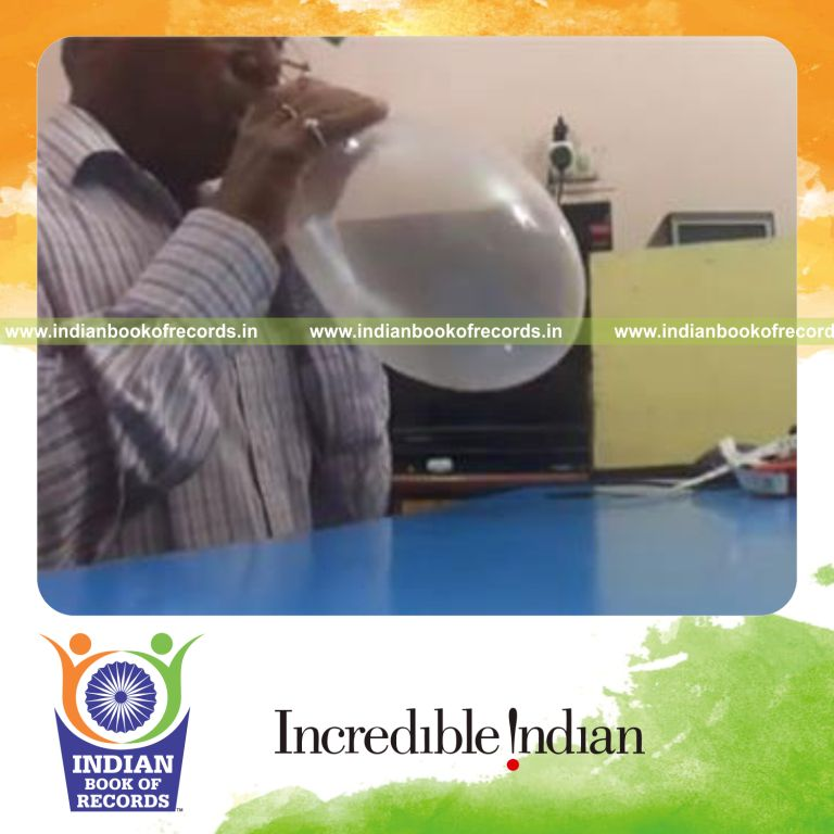 individual blowing balloon until it pops for record in Indian Book of Records