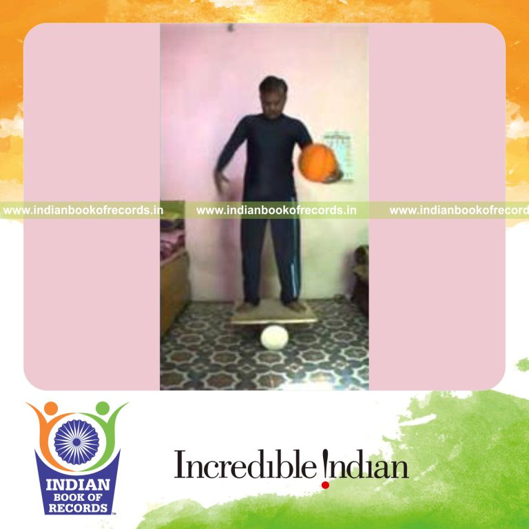 individual circling basketball around waist while balancing on rola bola for record in Indian Book of Records