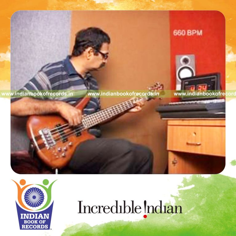 individual playing bass guitar at fastest speed for record in Indian Book of Records