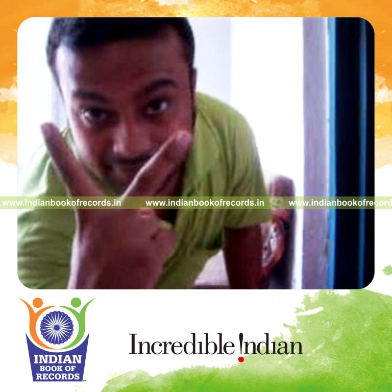 individual performing brian twist card cut behind the back for record in Indian Book of Records