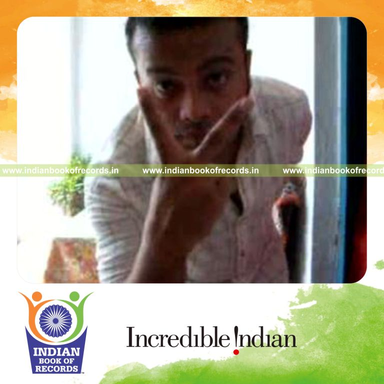 individual performing chen ka card cut behind the back for record in Indian Book of Records