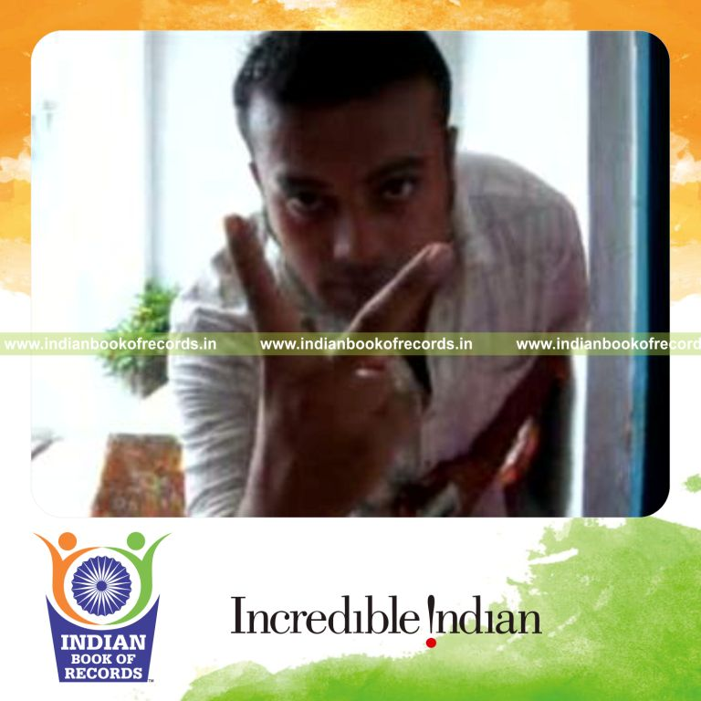 individual performing muse card cut behind the back for record in Indian Book of Records