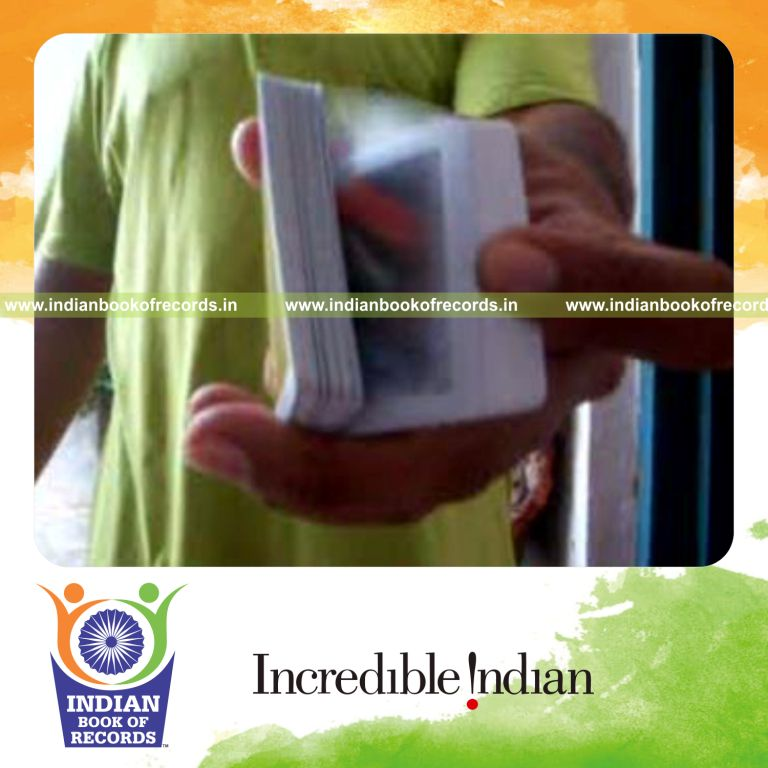 individual performing sabers double trouble card cut behind the back for record in Indian Book of Records