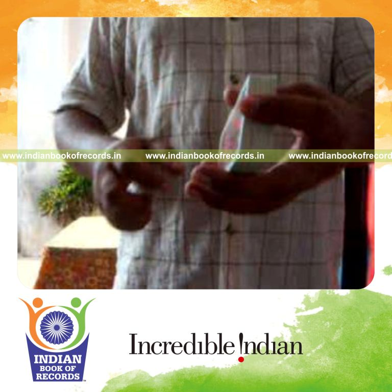 individual performing sabers flipper card cut behind the back for record in Indian Book of Records
