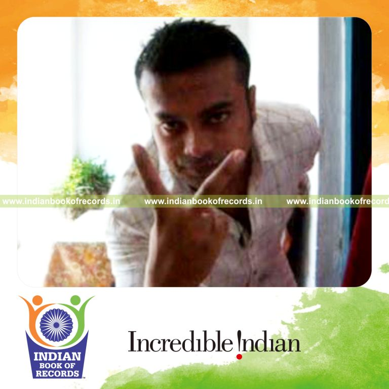 individual performing three packet thumb cut behind the back for record in Indian Book of Records