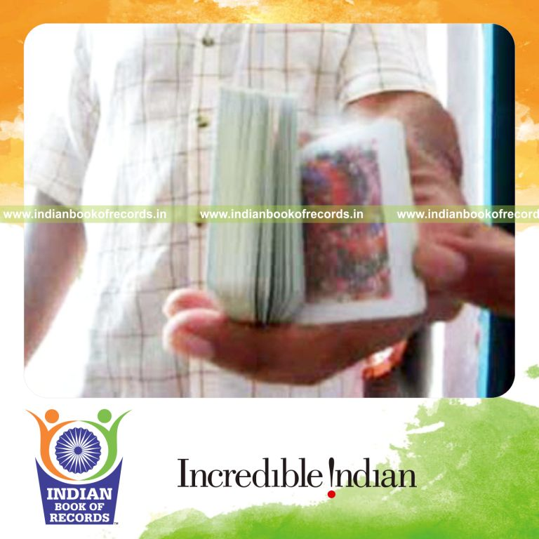 individual performing thumb card cut behind the back for record in Indian Book of Records