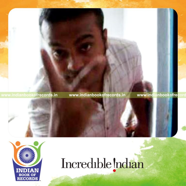 individual performing triple charlier card cut behind the back for record in Indian Book of Records