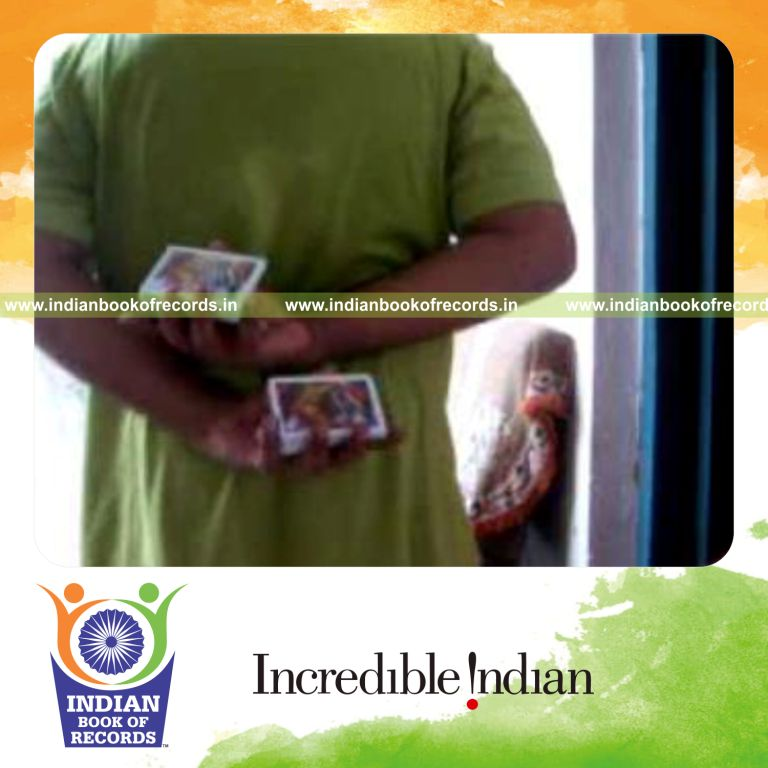 individual performing two handed sabers revo flipped card cut behind the back for record in Indian Book of Records