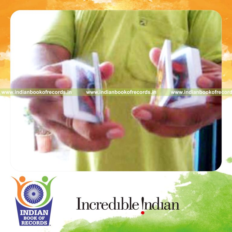individual performing two handed three packet thumb card cut behind the back for record in Indian Book of Records