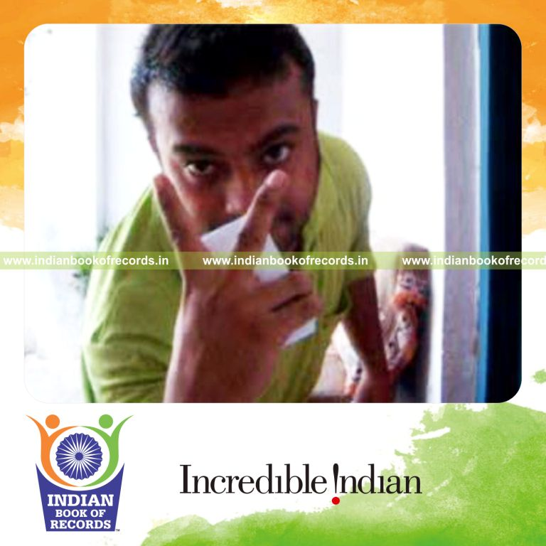 individual performing two handed triple charlier card cut behind the back for record in Indian Book of Records