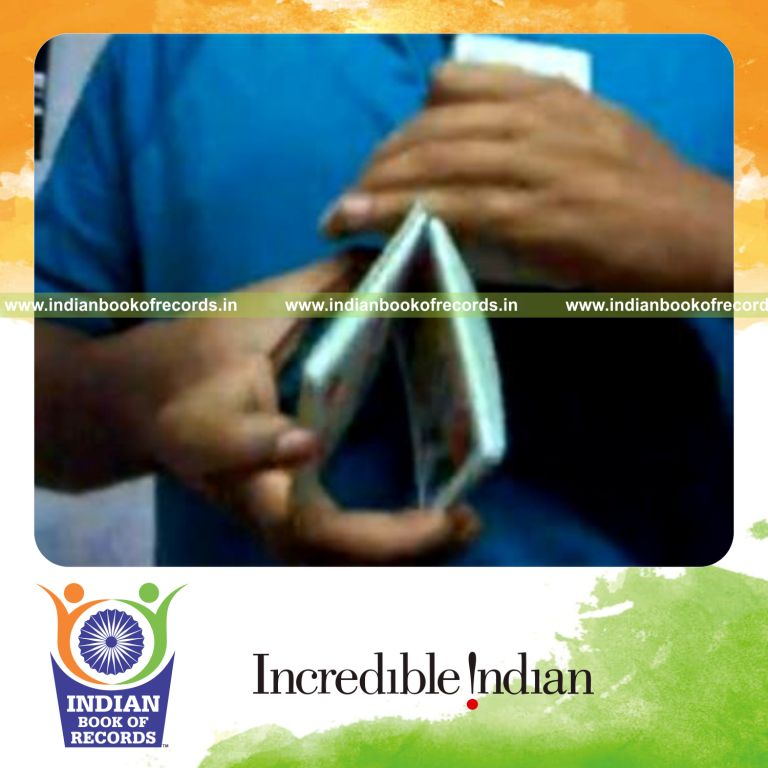 individual performing bicycle card cut for record in Indian Book of Records