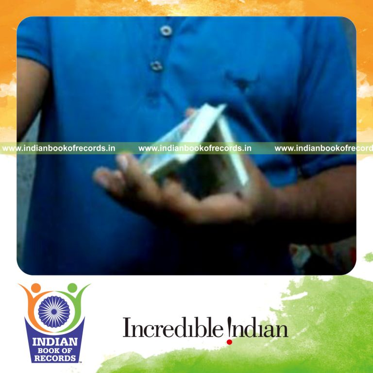 individual performing brian twist card cut for record in Indian Book of Records