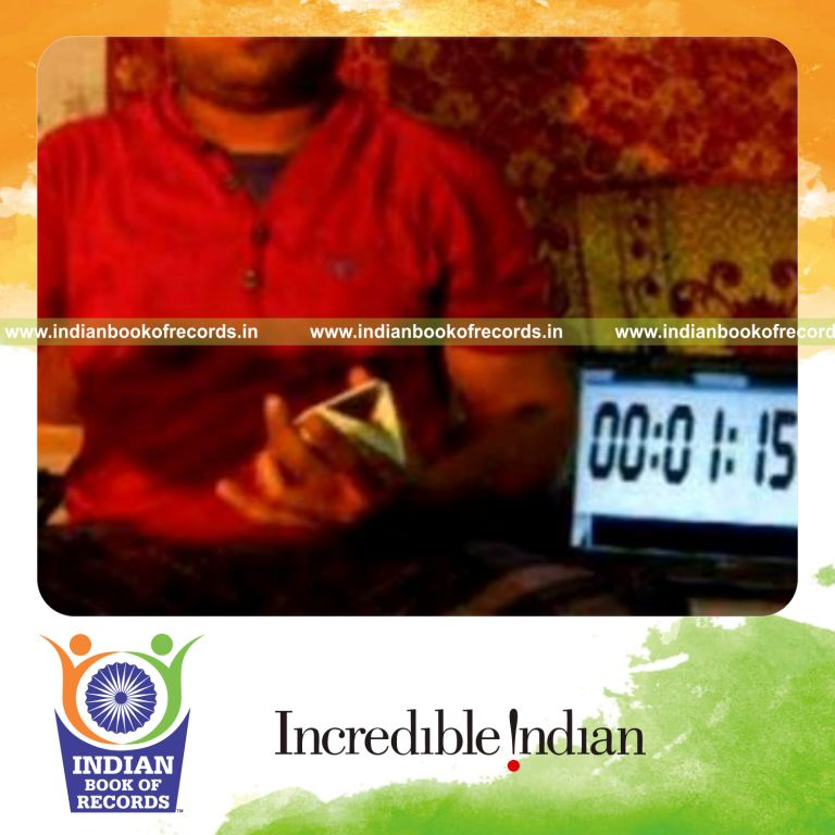 individual performing brian twist card cut while spinning toothbrush on pen for record in Indian Book of Records