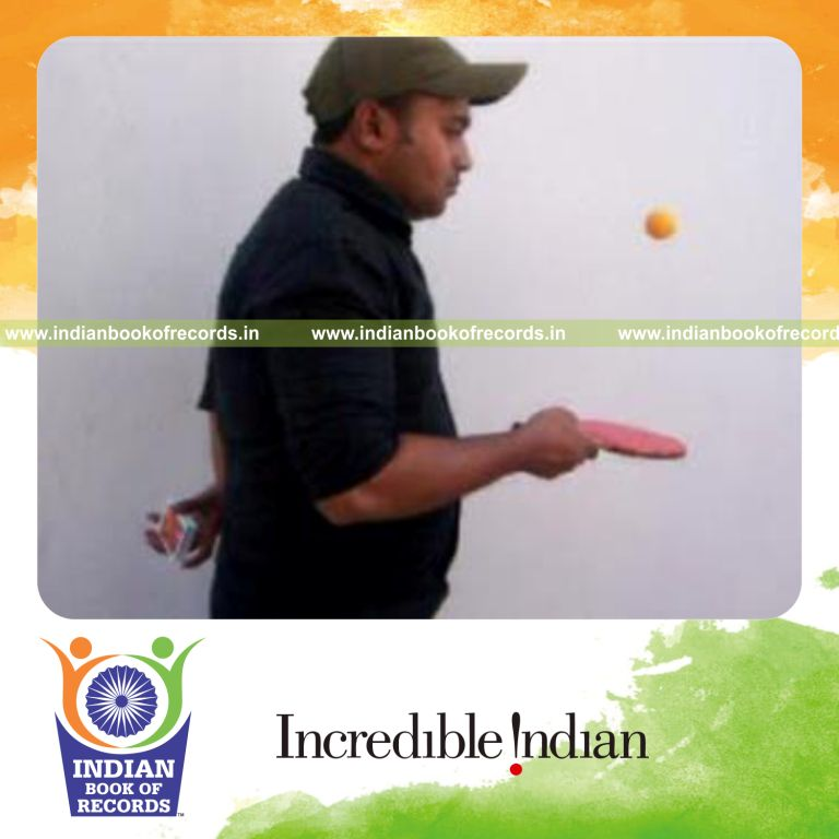 individual performing charlier and cox uker cuts behind back while bouncing table tennis ball for record in Indian Book of Records