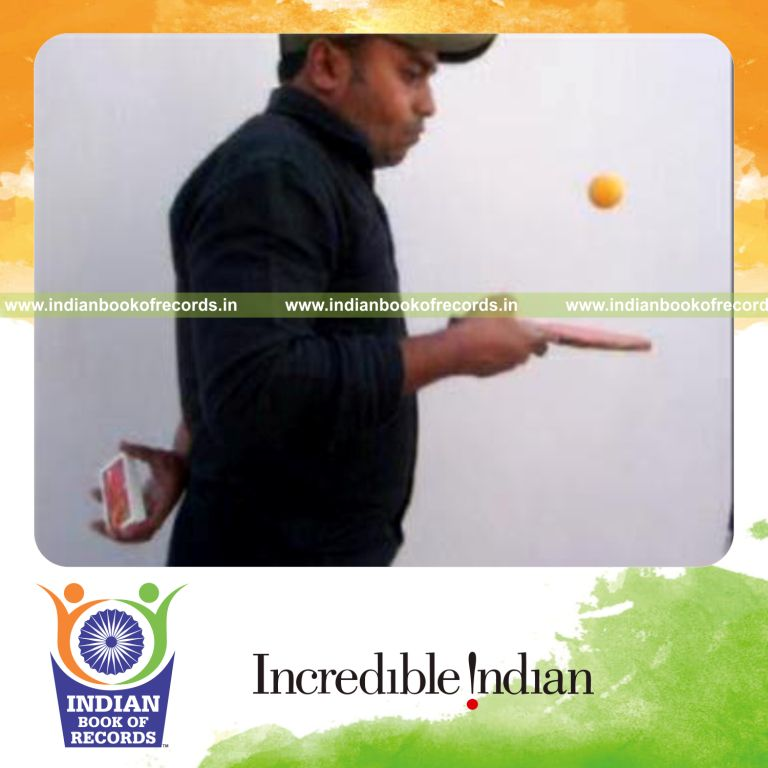 individual performing charlier and muse cuts behind back while bouncing table tennis ball for record in Indian Book of Records