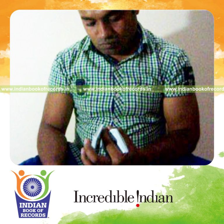 individual performing charlier and three packet thumb cuts quickly for record in Indian Book of Records