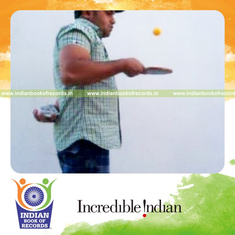 individual performing charlier and three packet thumb cuts behind back while bouncing table tennis ball for record in Indian Book of Records