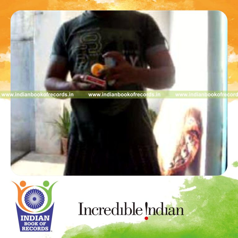 individual performing cox uker card cut while bouncing ball on deck for record in Indian Book of Records