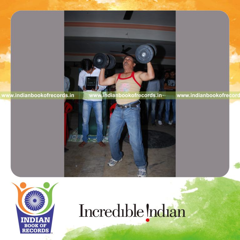 individual lifting 19 kilogram dumbbells overhead repeatedly for Indian Book of Records