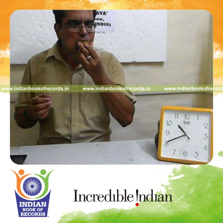 individual eating kiwi fruit in fastest time for record in Indian Book of Records