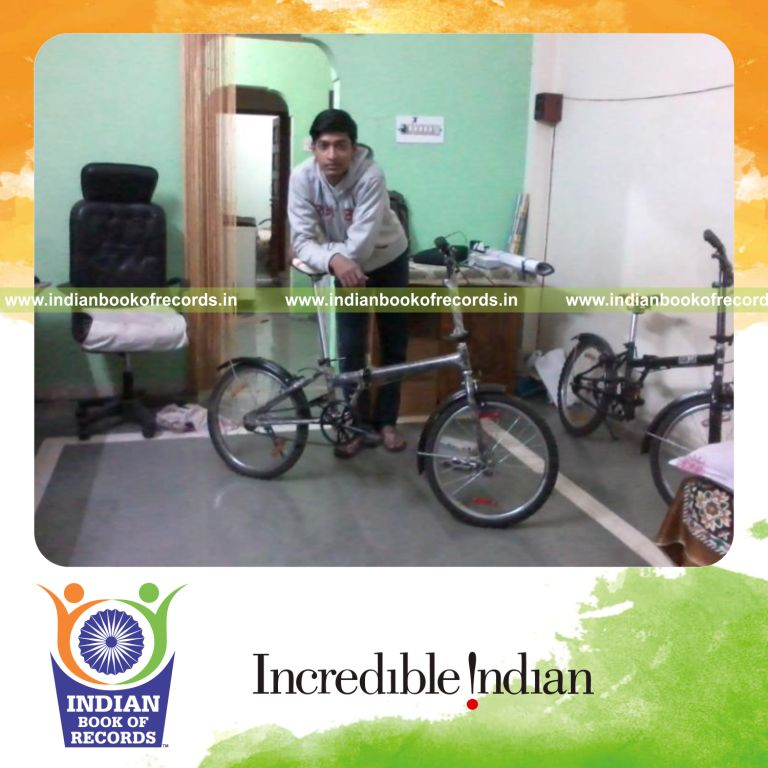 male individual creating fastest folding bicycle for record in Indian Book of Records