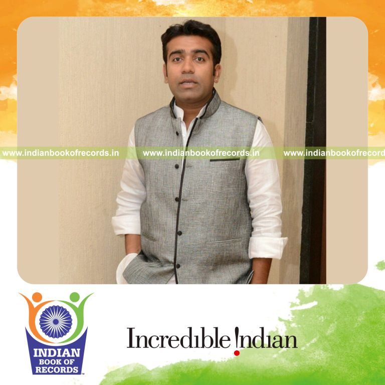 male shaking hands with multiple people quickly for Indian Book of Records