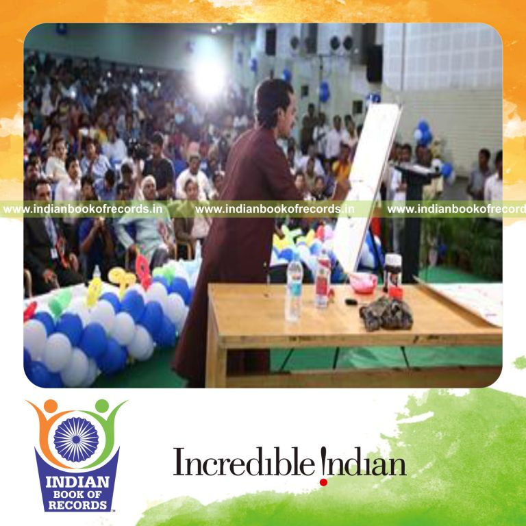 individual completing inverted painting while singing in fastest time for record in Indian Book of Records
